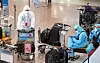 Migrant workers from Indonesia, wearing full protective gear, enter the arrival gate at Incheon International Airport on Thursday in spite of the exponentially spreading Covid-19 Delta variants. [YONHAP]