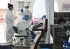 Medical staff in full quarantine gear are seen at a testing center in Gangnam District, southern Seoul, on Tuesday. [YONHAP]