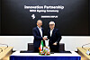 Benedetto Vigna, left, Ferrari CEO, and Samsung Display CEO Choi Joo-sun pose for a photo during a signing ceremony held at the Samsung Display's Asan plant in South Chungcheong on Tuesday. [SAMSUNG DISPLAY]