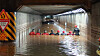 Fire fighters rescue trapped passengers after the flooding of an underpass in Busan’s Dong District Thursday due to torrential rainfall which killed three people. [BUSAN METROPOLITAN POLICE AGENCY]