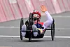 Lee Do-yeon waves as she crosses the finish line of the women's class one to four road race at the Fuji International Speedway in Shizuoka, Japan. [JOINT PRESS CORPS/YONHAP]