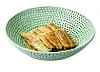 Jeon, or small pancakes, made with burdock, served on top of a plate inspired by Goryeo celadon. [ARUMJIGI]
