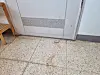 Bloody footprints outside the door of an apartment unit in Gwangmyeong, Gyeonggi where a man allegedly killed his wife and two sons on Tuesday night. [LEE BYUNG-JUN]