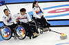 Jung Sung-hun lines up his shot in a game against Estonia during the wheelchair curling round robin tournament at the Beijing Paralympics on Wednesday. [REUTERS/YONHAP]
