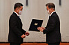 President Moon Jae-in, right, hands an appointment letter to Defense Minister Suh Wook on Friday. [BLUE HOUSE]