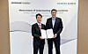Doosan Enerbility Executive Vice President Sohn Seung-woo, left, and Siemens Gamesa offshore business unit CEO Marc Becker pose during a signing ceremony in Copenhagen. [DOOSAN ENERBILITY]