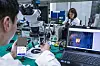 Researchers from SK Telecom affiliate IDQuantique test a quantumrandom number generator chipset to be installed in the Galaxy A Quantum at the telecom company's office in Bundang, Gyeonggi. [SK TELECOM]