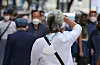 A person walks down a street in Myeongdong, central Seoul, without a mask on Tuesday afternoon. [YONHAP]
