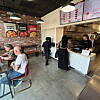 People ordering food in the BBQ LA Hollywood store [GENESIS BBQ]