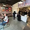 People ordering food in the BBQ LA Hollywood store [GENESIS BBQ]