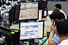 Employees at Hana Bank in central Seoul process transactions in a dealing room in August. [YONHAP]