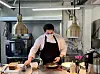 Loyd Blakely cooks brunch behind the open kitchen of Lucyd. [LEE JIAN]