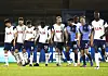 Tottenham Hotspur players react after Tanguy Ndombele, fourth from left, scored his side's third goal assisted by Son Heung-min, far left, against Wycombe Wanderers at Adams Park in High Wycombe, Britain, on Monday. [AP/YONHAP]