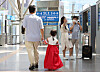 A child dresssed in hanbok walks along a platform at Seoul Station with her parent on the first day of the Chuseok holiday on Sept. 9, 2022. [YONHAP]