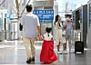 A child dresssed in hanbok walks along a platform at Seoul Station with her parent on the first day of the Chuseok holiday on Sept. 9, 2022. [YONHAP]