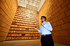 Artist Jung Yeon-doo stands in front of his 14-meter (46-foot)-tall installation piece “Wall of Blades” (2023) on display at the Museum of Modern and Contemporary Art (MMCA) Seoul for the 'MMCA Hyundai Motor Series 2023' titled “One Hundred Years of Travels,″ during a press tour on Sept. 5. [MMCA]
