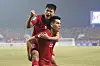 Vietnam's Nguyen Quang Hai celebrates with his teammate during a semifinal match against Indonesia at the AFF Championship in Hanoi, Vietnam on Monday. [AP/YONHAP]