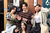 Theo, a virtual human, takes a photo with his friends. [SCREEN CAPTURE]
