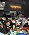 Park and volunteers make kimchi for free meals at Legacy Kitchen. [KOREA LEGACY COMMITTEE]