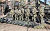 Servicemen are seen by military equipment captured by Russian troops on March 15, 2022. Ten Javelin American-made portable anti-tank missile systems, grenade launchers, man-portable air-defense systems were discovered at a base that was taken under control of the Russian Armed Forces near the village of Huta-Mezhyhirska. [YONHAP/TASS]