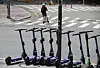 E-scooters parked around Hongik University in western Seoul on Tuesday. The once-popular ride has lost many users since tough restrictions, requiring a drivers license and helmet and banning more than one person from riding on the same scooter, were implemented from May 13. [YONHAP]