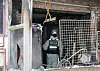 An investigator from Gyeonggi Disaster and Safety Headquarters inspects the Nigerian family's house in Seonbu-dong in Danwon District, Gyeonggi, which was entirely burned after a fire broke out Monday morning, killing four Nigerian siblings. [NEWS1]