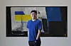 Bek Hyun-jin poses for a photo after an interview with the Korea JoongAng Daily in front of his work 'Bright Darkness' (2020) at PKM Gallery in central Seoul Wednesday. [PARK SANG-MOON]
