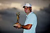 Scottie Scheffler poses with the tournament trophy after winning The Players Championship at Stadium Course at TPC Sawgrass on Sunday in Ponte Vedra Beach, Florida. [GETTY IMAGES]