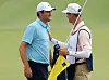 Scottie Scheffler celebrates with caddie Ted Scott after winning on the 18th green during the final round of The Players Championship on The Players Stadium Course at TPC Sawgrass on Sunday in Ponte Vedra Beach, Florida. [GETTY IMAGES]