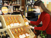 A model looks at a wine at a wine store in Lotte Mart in downtown Seoul. [LOTTE MART]