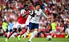 Arsenal's Thomas Partey, left, and Tottenham's Son Heung-min in action during a Premier League match in London on Saturday. [EPA/YONHAP]