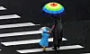 A child and an adult hold umbrellas while crossing a road in Wanju County, North Jeolla, as rain falls on Sunday. [NEWS1]