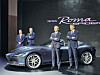 Ferrari CEO Benedetto Vigna, second from right, poses for a photo next to the Ferrari Roma Spider, a convertible sports car, displayed at the Universo Ferrari exhibition at Dongdaemun Design Plaza in Jung District, central Seoul, on Thursday.