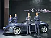 Ferrari CEO Benedetto Vigna, second from right, poses for a photo next to the Ferrari Roma Spider, a convertible sports car, displayed at the Universo Ferrari exhibition at Dongdaemun Design Plaza in Jung District, central Seoul, on Thursday.