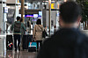 A person looks at a flight information display at Incheon International Airport’s Terminal 1 on Nov. 2 [NEWS1]