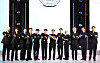 Airbnb CEO Brian Chesky, seventh from left, poses with boy band Seventeen ahead of the Seventeen’s 10th Anniversary experience in Yongsan District, central Seoul. [NEWS1]