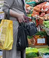 A customer shops at a traditional market in Seodaemun District, central Seoul, on Wednesday. Inflation over the 12 months from May is forecast at 3.3 percent, up 0.2 percentage points from a month earlier, according to the Bank of Korea on Tuesday. [YONHAP]