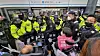 Members of the Solidarity Against Disability Discrimination (SADD) are blocked by the police at Samgakji Station in central Seoul on Monday. [SOLIDARITY AGAINST DISABILITY DISCRIMINATION]