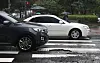 A black car is about to drive over a pothole in Seoul on July 18. [NEWS1]
