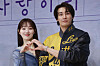 Lee Sung-kyung, left, and Kim Young-kwang pose for a photo during a press conference for Disney+'s ″Call It Love″ at a hotel in Dongdaemun District, eastern Seoul, on Tuesday. [YONHAP]