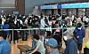 Travelers wait in line to check in their luggage for flights at Incheon International Airport Terminal 2 on Wednesday, as the demand for overseas travel has increased since the lifting of mandatory Covid-19 tests for entry. [NEWS1]