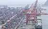 Cranes load containers for export on outbound ships at a port in Busan on June 12. [YONHAP]
