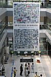 The banner exhibiting the portraits of 388 Korean War veterans is placed at the Nam District Office in Busan on Thursday to commemorate the 71st anniversary of the outbreak of the Korean War and the 70th anniversary of the foundation of the UN Memorial Cemetery in Korea in Busan. [SONG BONG-GEUN]