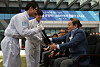 Lee Kun-hee, right, is given the first semiconductor wafer manufactured at a production line in Samsung's Nano City, one of Samsung’s main chip manufacturing bases in Gyeonggi, in September 2011. [NEWS1]