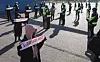 The Korean Confederation of Trade Unions holds a socially distanced really near the National Assembly in Yeouido, western Seoul, Friday amid the city government’s ban on rallies because of the spike in Covid-19 cases, with police watching on. [NEWS1]
