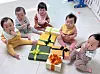 The first set of quintuplets born in Korea in 34 years, the Kim siblings, pose for a photo with presents from First Lady Kim Keon-hee on Sunday. [YONHAP]