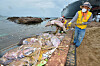 Workers clear up dead tuna washed up on Jangsa Beach in Yeongdeok Island, North Gyeongsang, on July 28. [NEWS1]