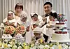 Captain Seo Hye-jeong, left, and Captain Kim Jin-su, right, hold their quintuplet babies during the children's first birthday party on Saturday. [YONHAP]