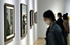 Visitors look at works on display at MMCA Seoul’s permanent exhibition ’MMCA Collection Highlights 2020+“ on Thursday in central Seoul while wearing masks and standing away from each other in an effort to abide by social distancing guidelines. [YONHAP]