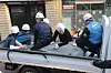 Sero the zebra heads back to the zoo, covered in a blanket and held down by six officials on a truck. [YONHAP]